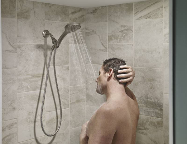 man in shower with eyes closed