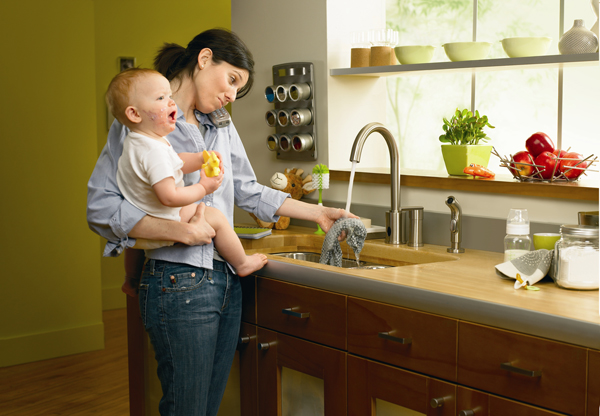 mom and baby at sink in kitchen