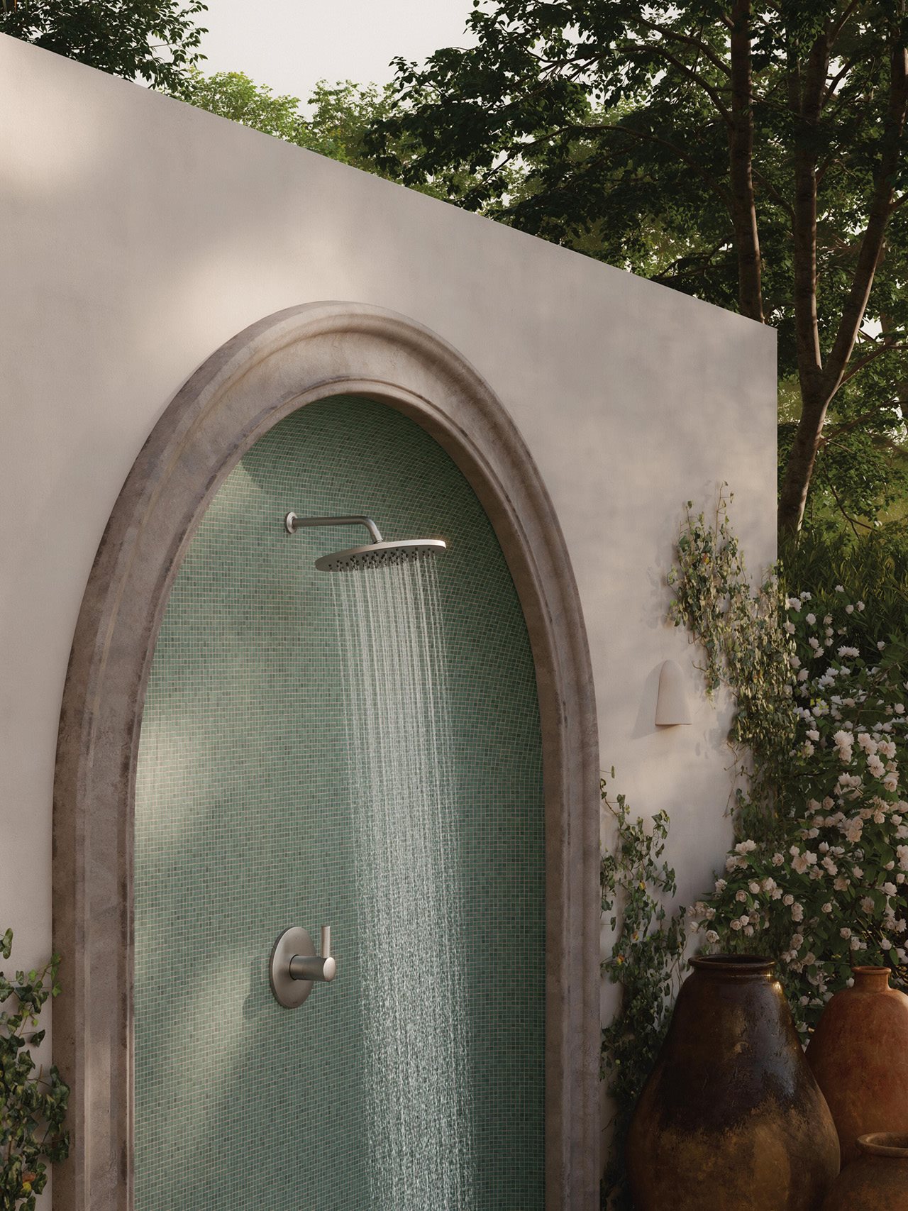An outdoor shower in a lush garden.