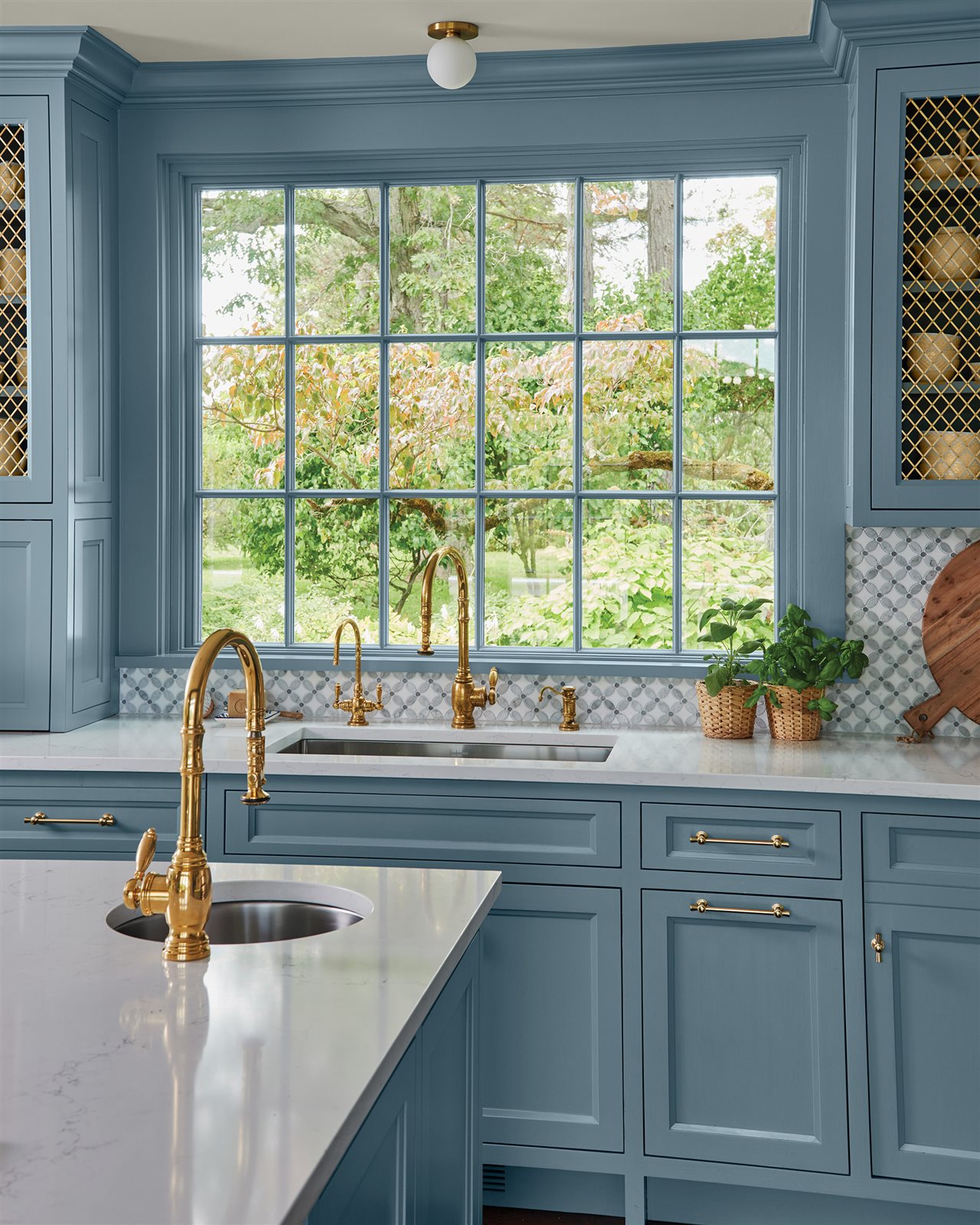 Kitchen cabinet and sink area updated with Pittsburgh Paints & Stains<sup><sup><sup><sup><sup>®</sup></sup></sup></sup></sup> version of Artifact, the 2027 Color of the Year.