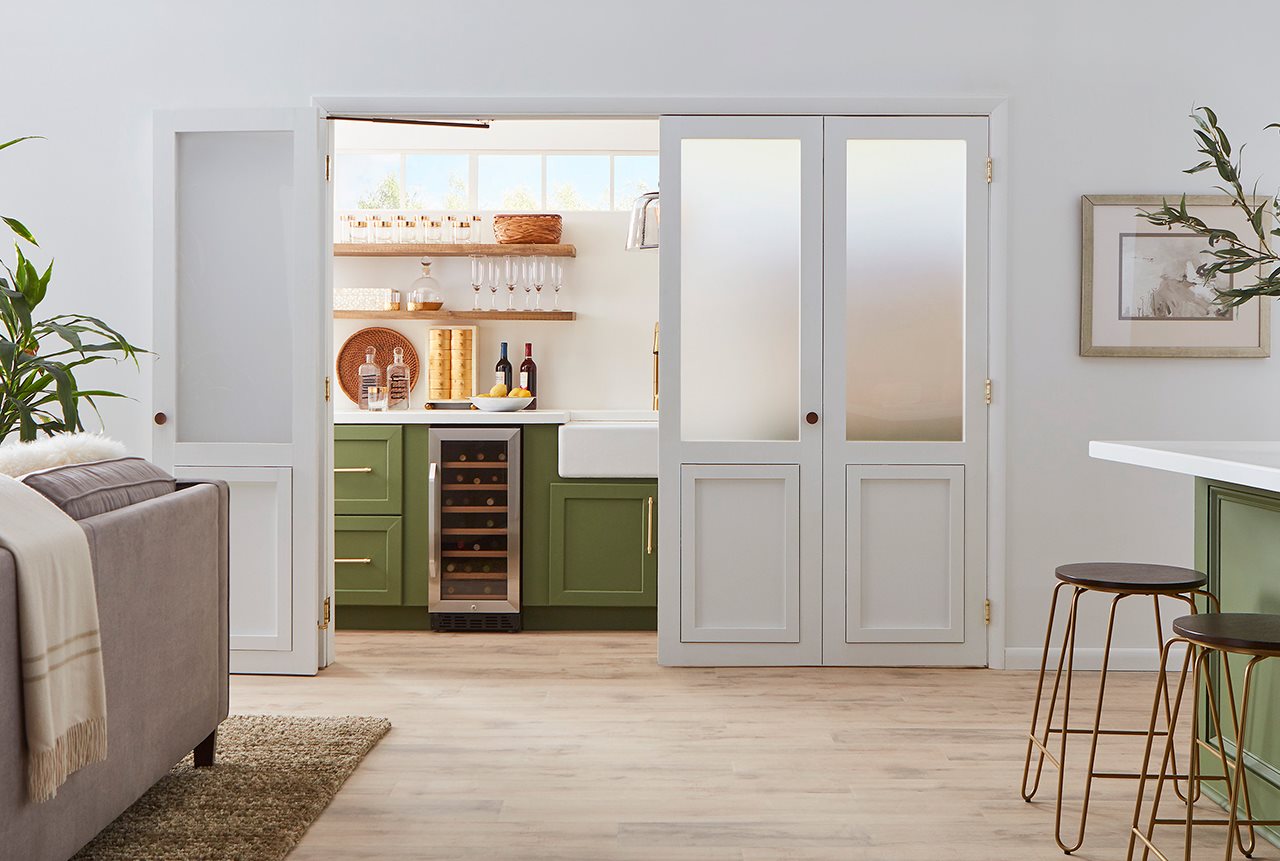 Wet bar behind foldable doors.