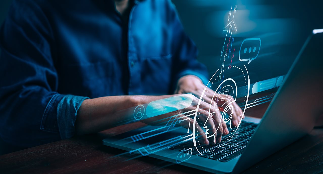 Man on laptop revamping the content he is writing to use a structured Q & A format and provide answers to questions his customers ask. This also helps AI bots to quickly discover the information.