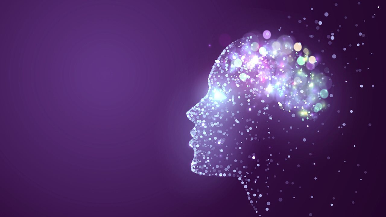 An illustration of a woman's head in a transparent, purple silhouette with multi-color lighted areas in the cranium; simulating brain actively.