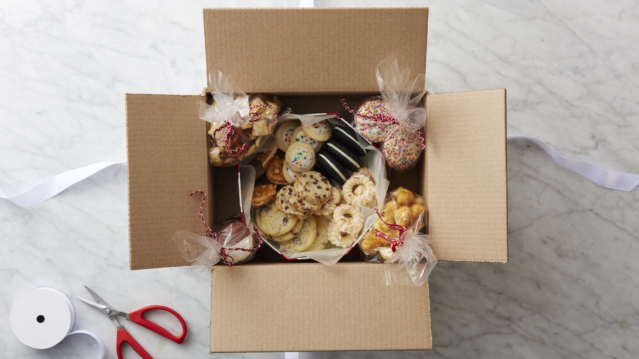 A box of holiday cookies and candies.