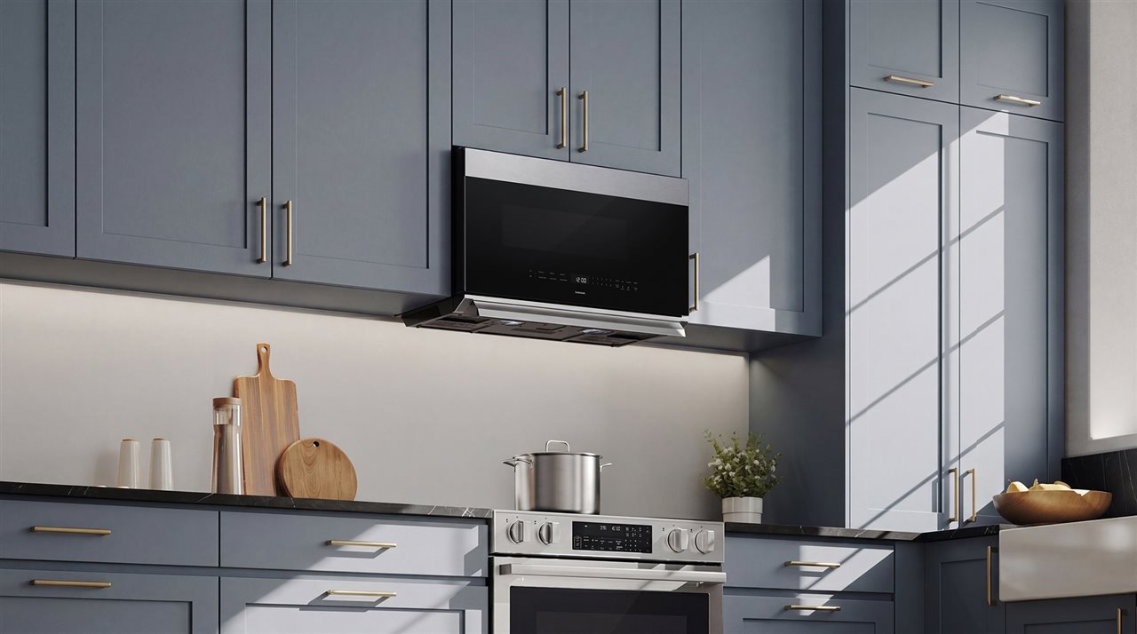 Samsung NSE90H63S Electric Range with over the counter micro-wave in a modern style kitchen.