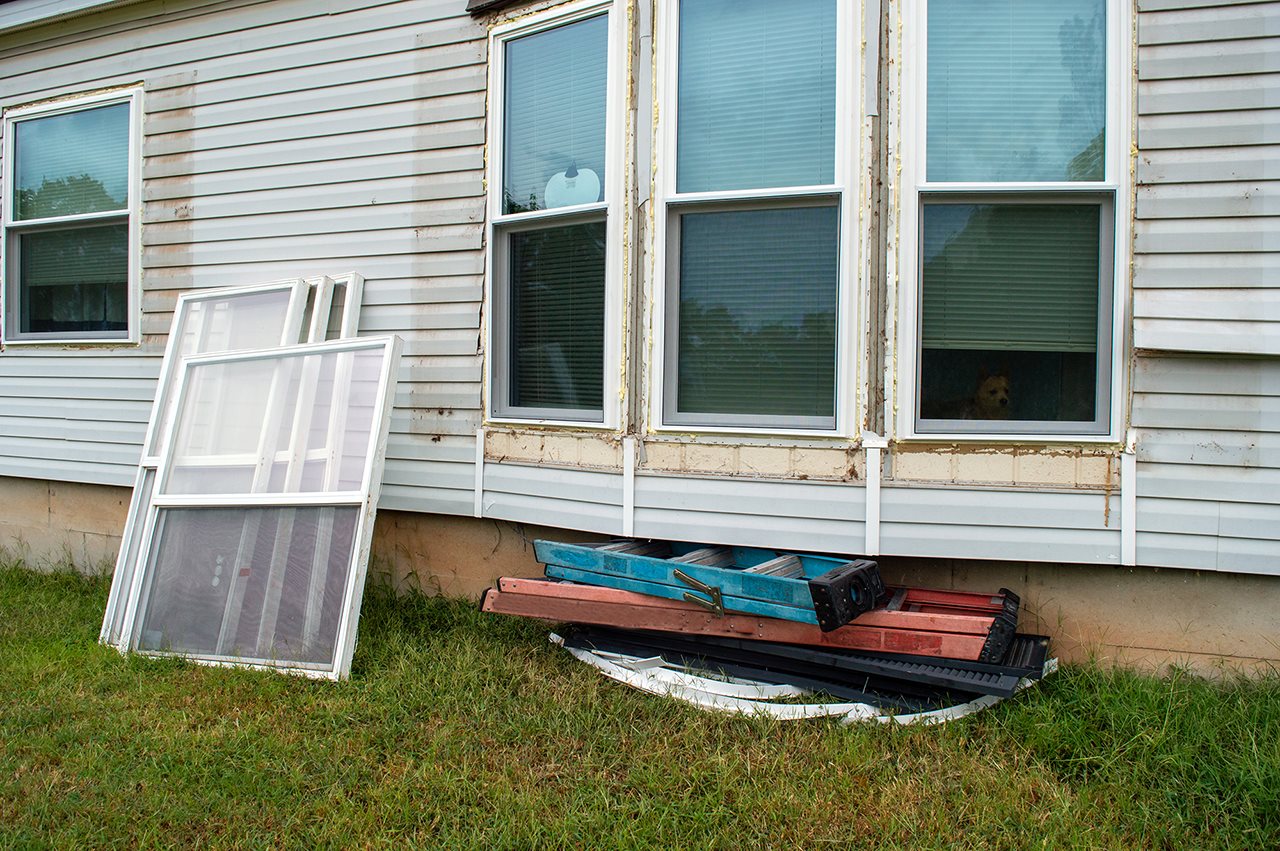 Home in the process of having the old windows removed and will be replaced by the new vinyl windows in their place.