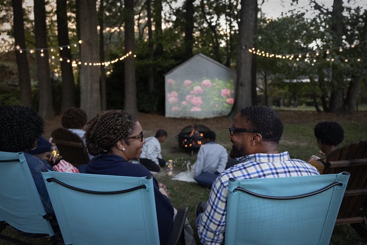U.S. Navy veteran Gerald and friends watching a home outdoors.