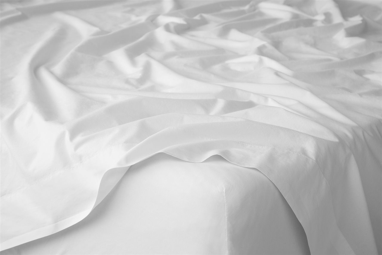 A mattress covered with Tuft & Needle's Classic Percale sheet set.