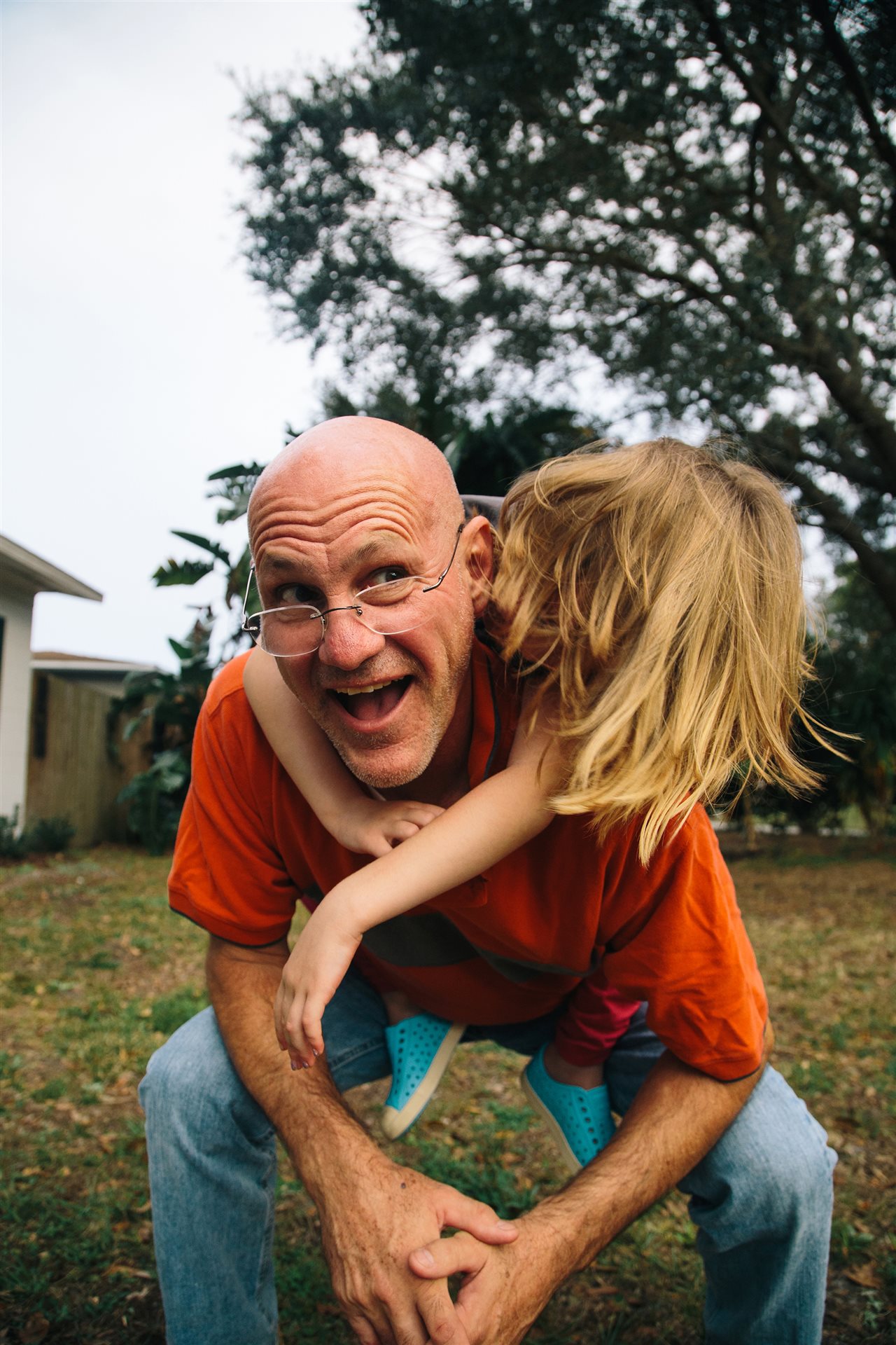 Grandfather giving grandchild a piggy back ride in the backyard. Abbott, recently conducted research on chronic disease.