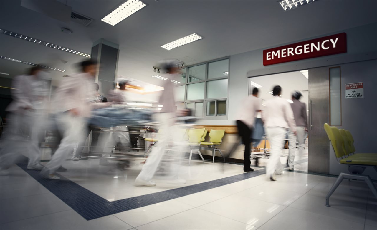Hosiptal staff quickly bringing patient in to ER.