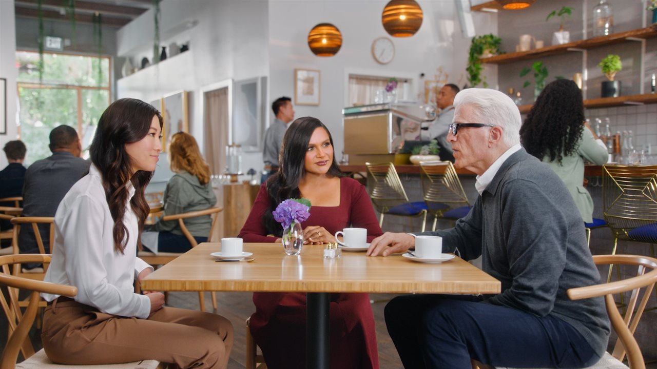 Doctor, Mindy and Ted talking at a cafe.