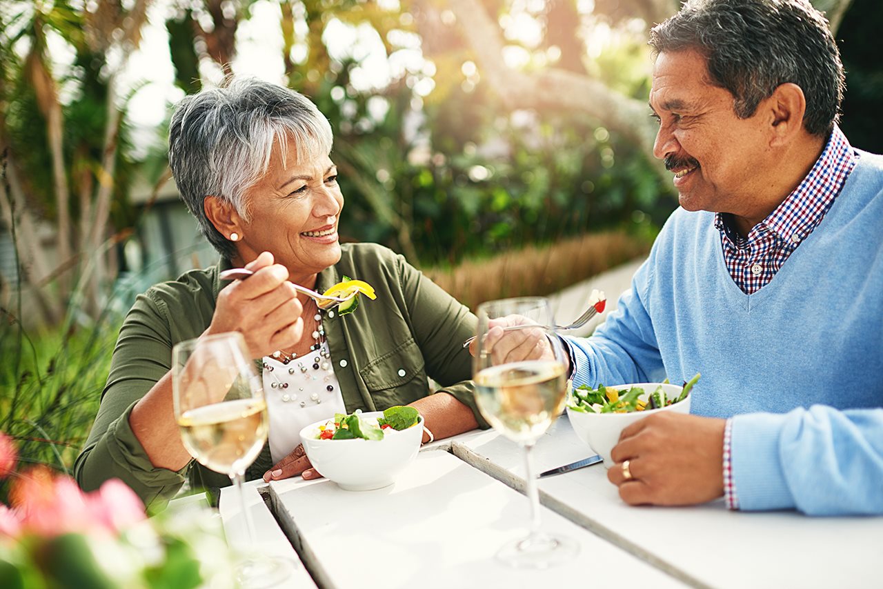 Older couple enjoying lunch outside