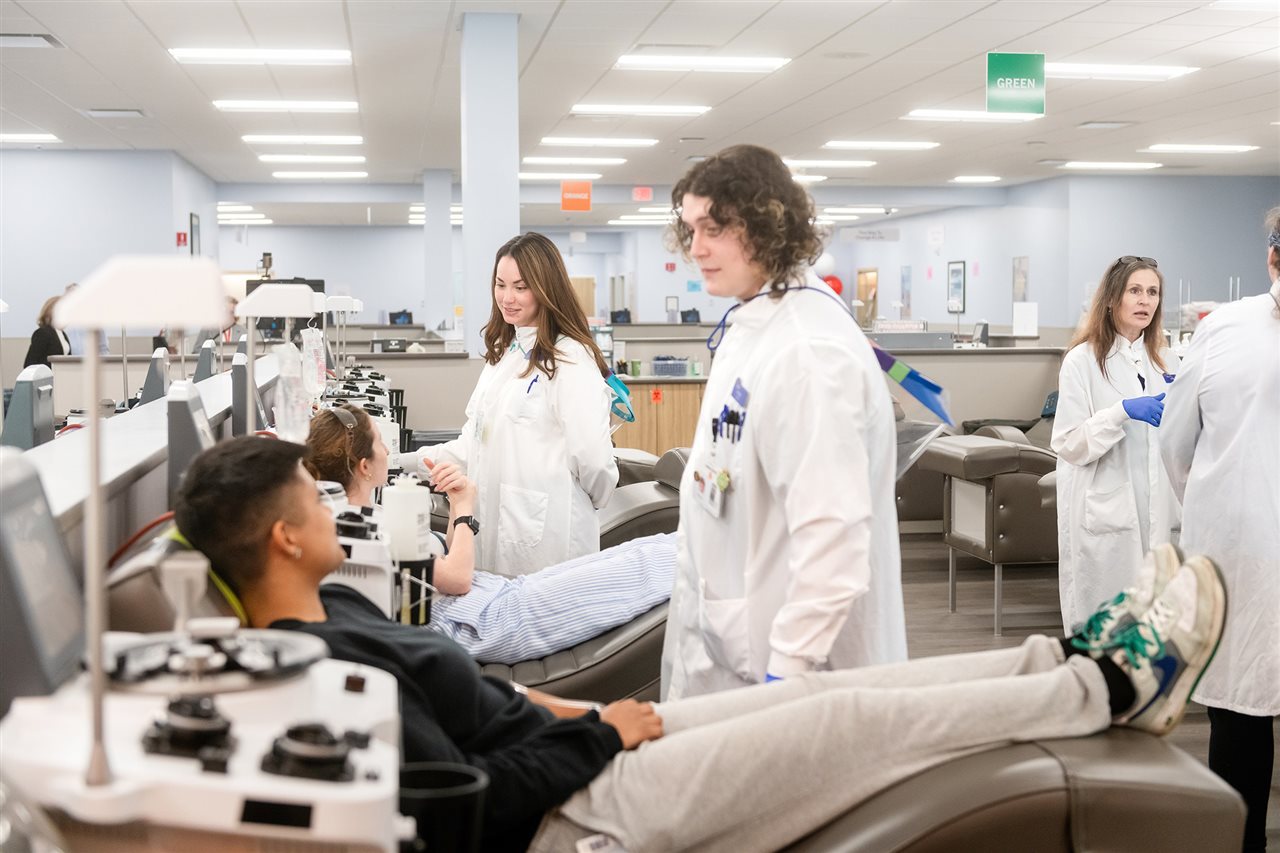 Several technicians help people donate blood. BioLife Plasma Services, part of Takeda, operates more than 235 blood centers.