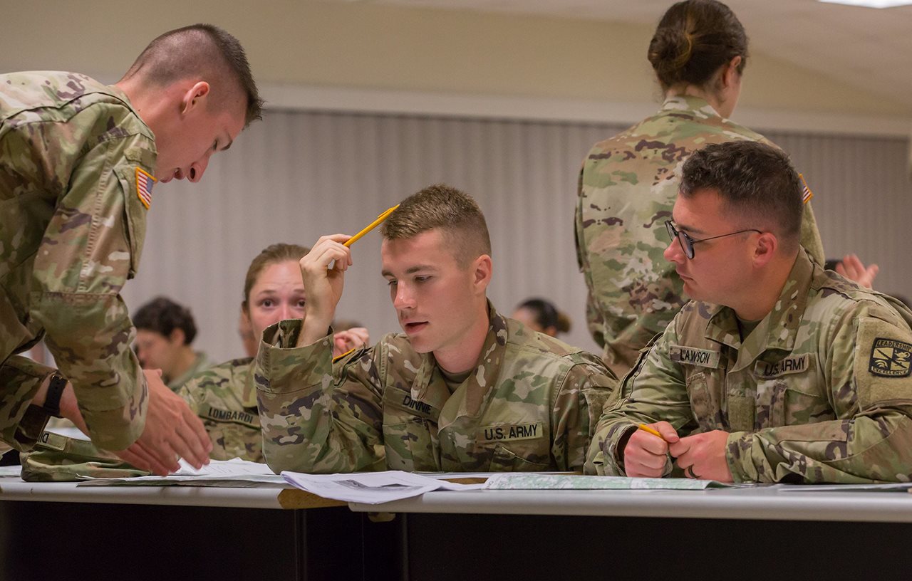 Soldiers of the U.S. Army Reserve and the Army National Guard studying in a classroom,