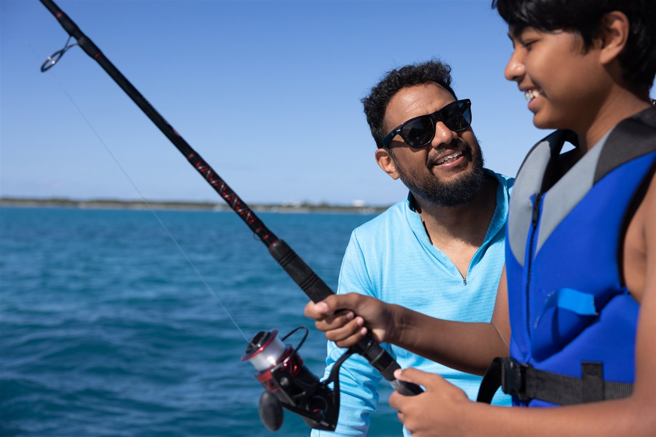 Father and son fishing on a lake