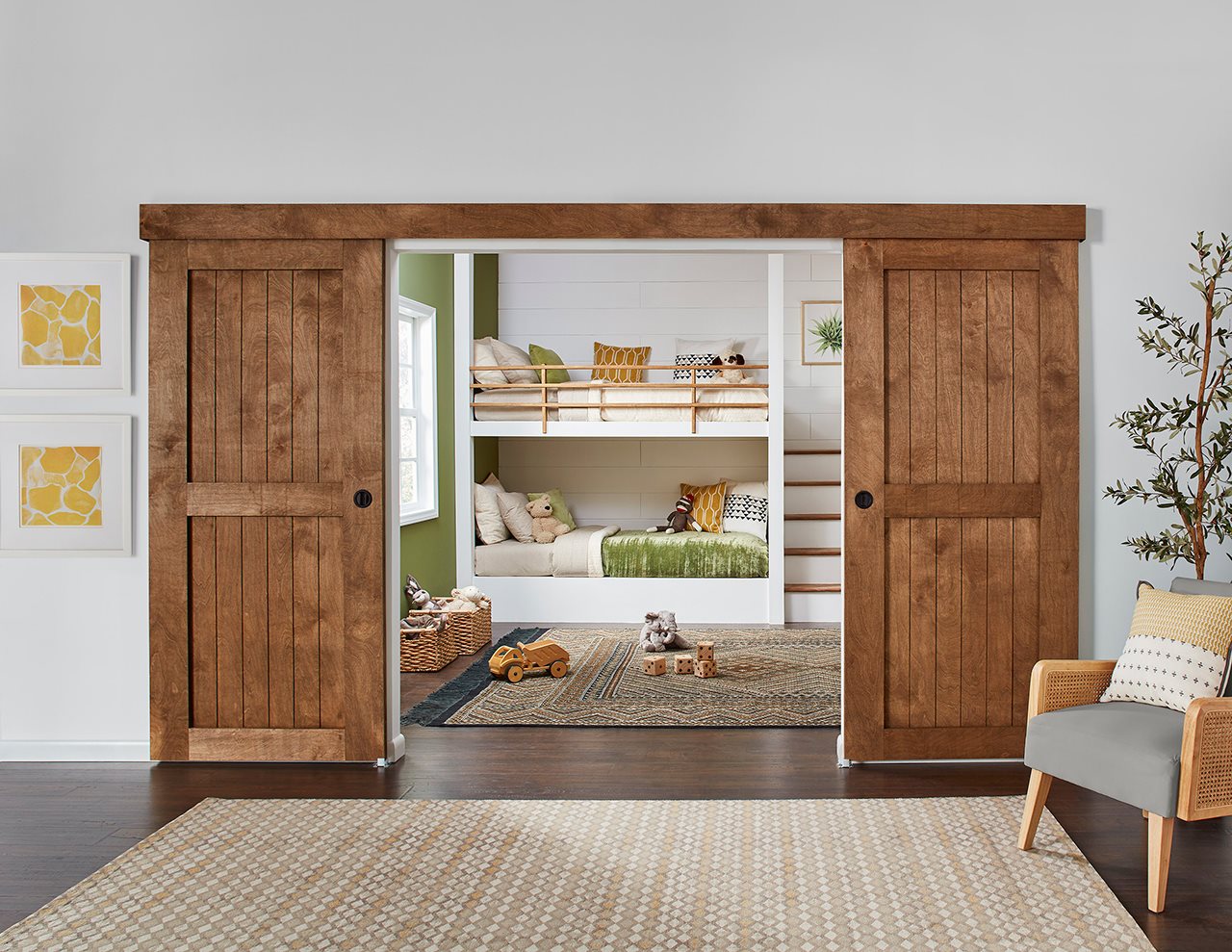 French pocket doors open reveiling built in bunk beds in a small room