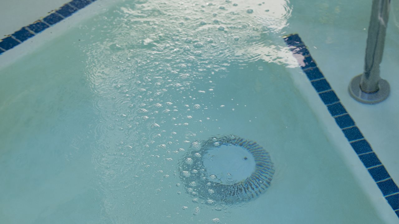 Swimming pool drain