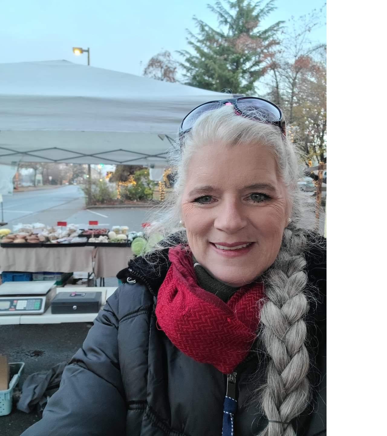 Lealani in a winter jacket and red scarf