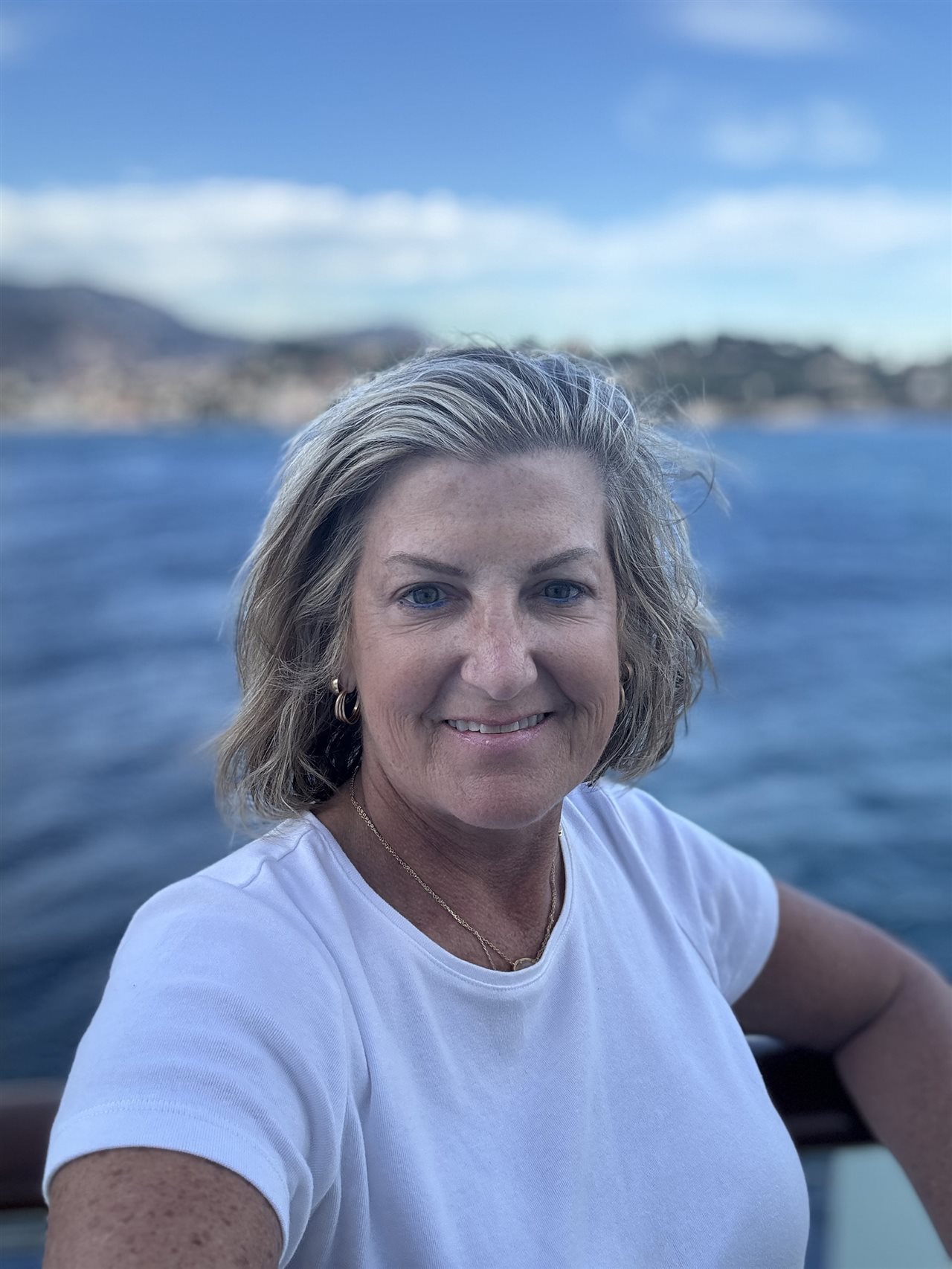 Close up of Marin in front of a lake