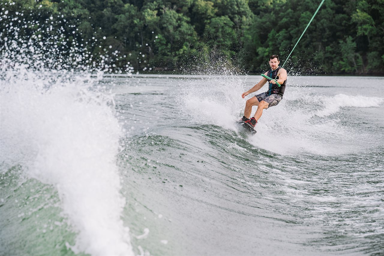 Man water skiing behind a boat. Visit DiscoverBoating.com