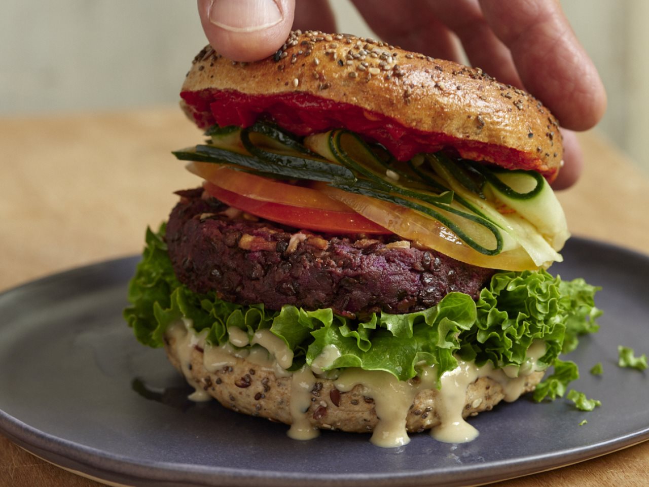 Burger with lettuce, tomato, cheese and other ingredients
