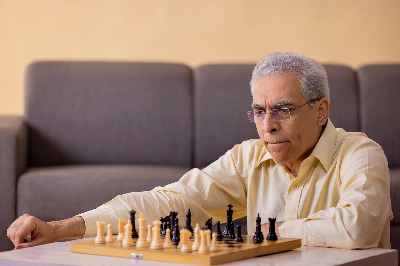 Older man playing chess