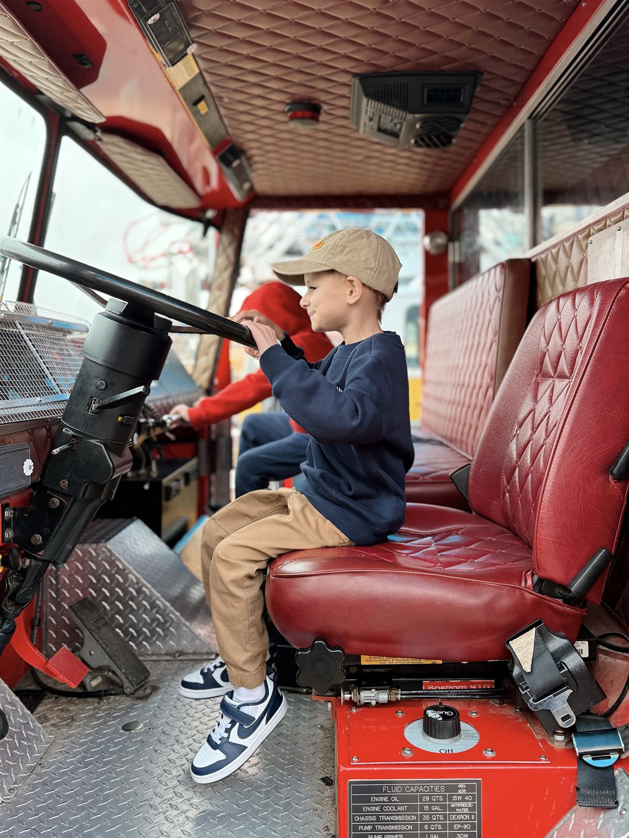 Make-A-Wish kid, Sam, operates dump truck and other giant machines in a safe, family-friendly environment.