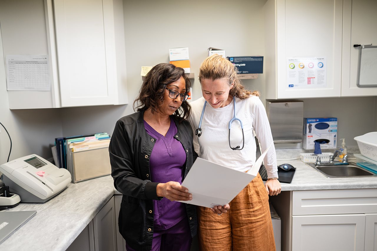 Doctor and nurse looking over paper work