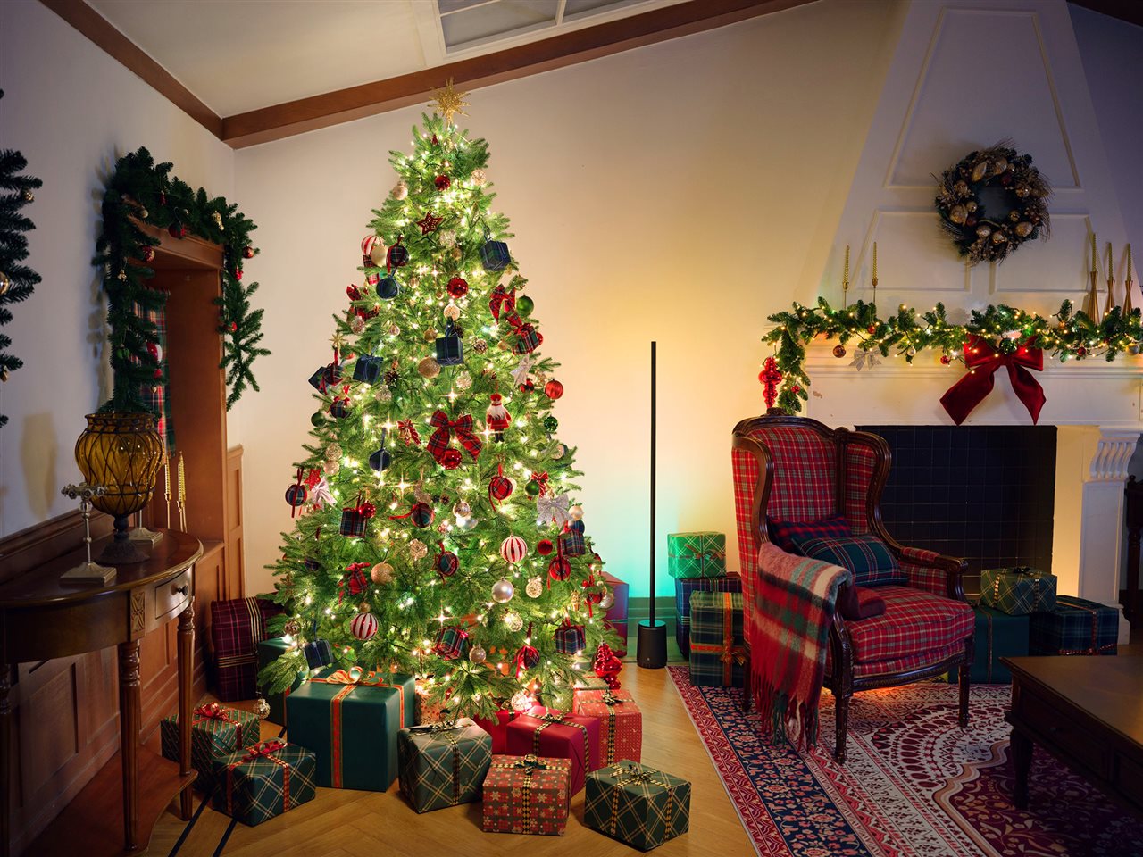 Beautifully decorated Christmas tree with packages under it.