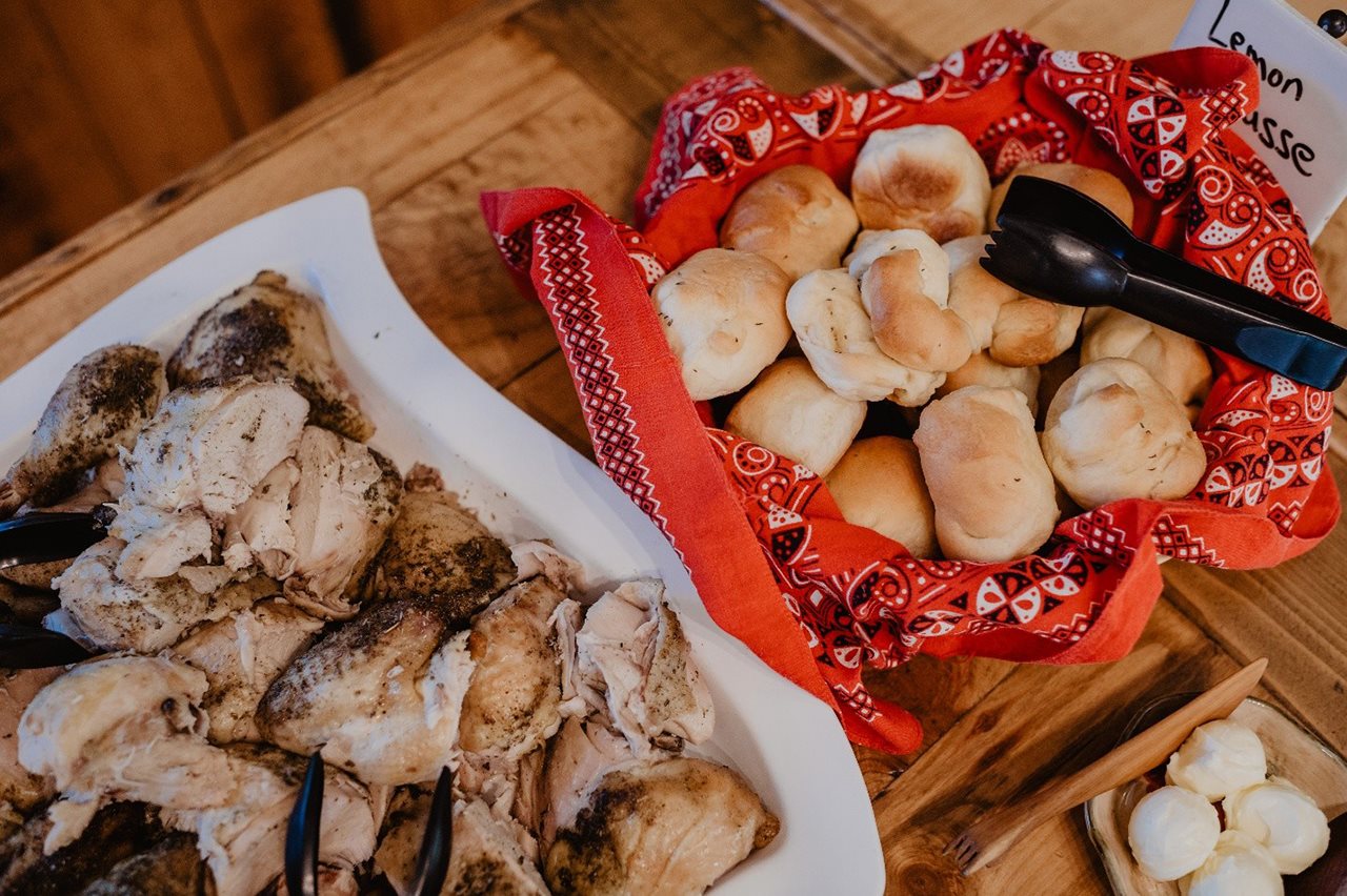 A table with chicken and biscuits for hungry dude ranch guests at Black Tail Ranch.