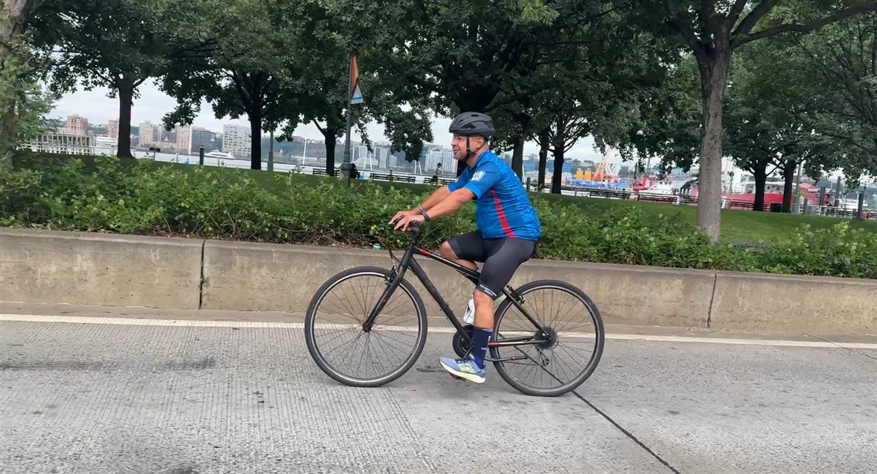 Gabriel, a member of Wounded Warrior Project, riding a bike.