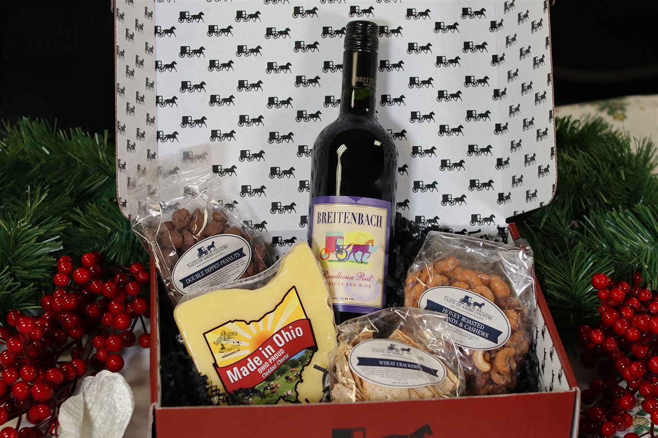 St. Annes Wine & Cheese Gift Box features Cheddar Cheese made in the shape of the state of Ohio, a bottle of wine and an assortment of nuts.