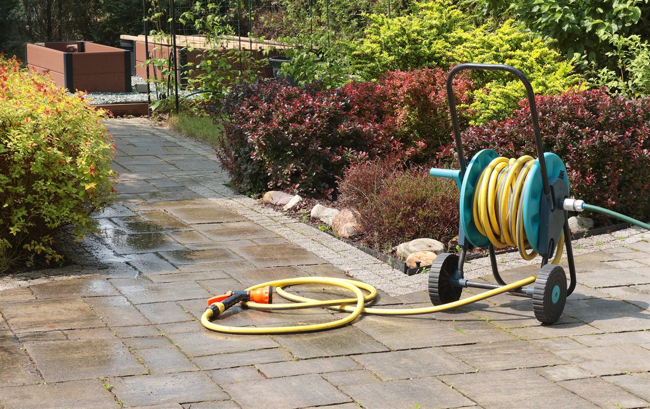 Vinyl hose in garden. The Vinyl Institute says vinyl can be used for pool liners, sprinkler systems, railings, and hoses.
