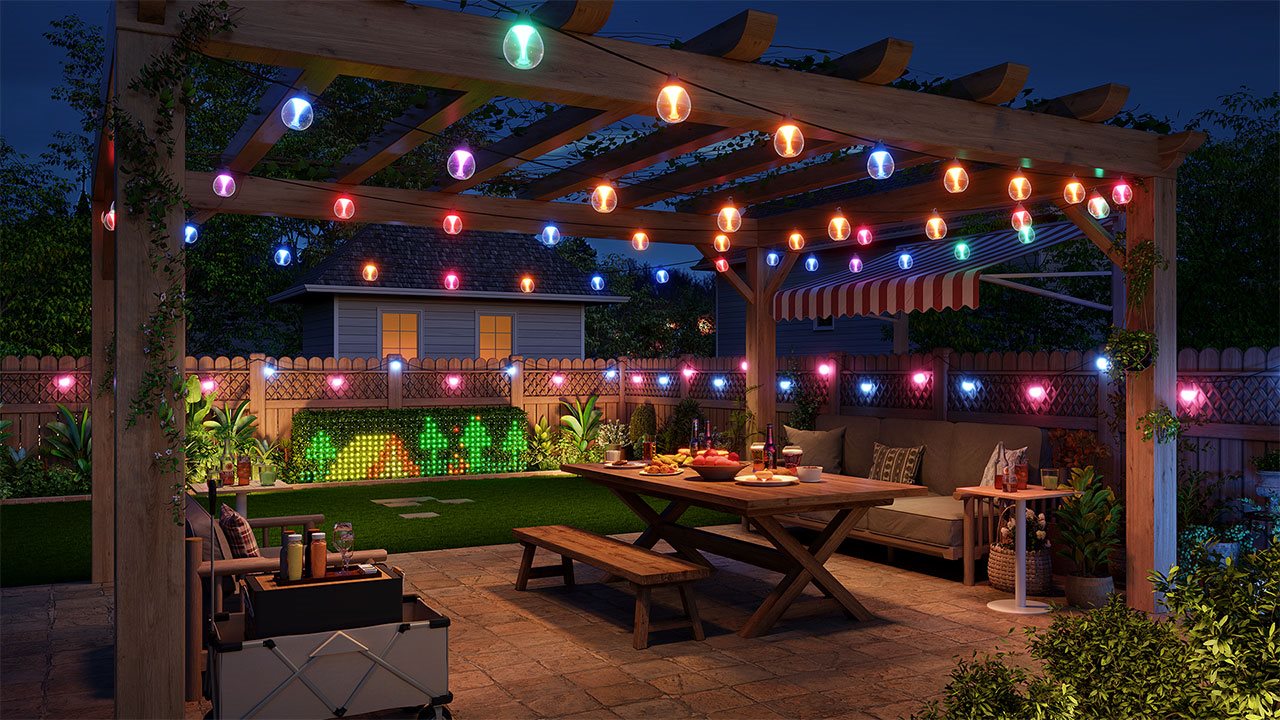 Pergala, featuring custom lighting, over a dinning area in the backyard.