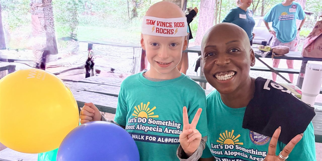 Ariel, a Volunteer Walk Site Leader and National Walk For Alopecia Ambassador, with friend giving the peace sign.