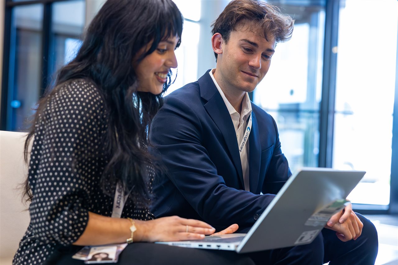 Woman at Cognizant talking with a new hire.
