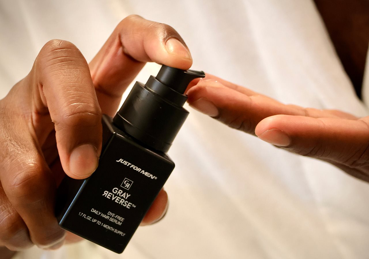 Just For Men Gray Reverse serum being applied to hand.