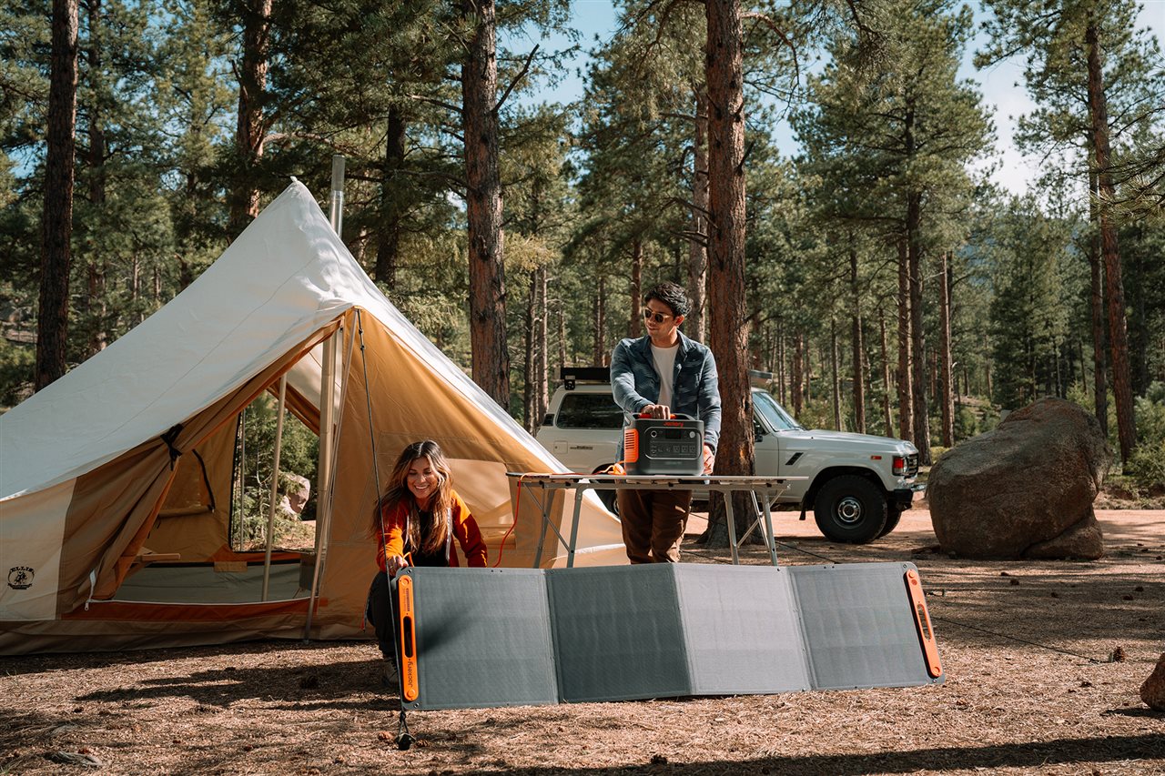 Couple camping using the Jackery Solar Generator 5000 Plus for power