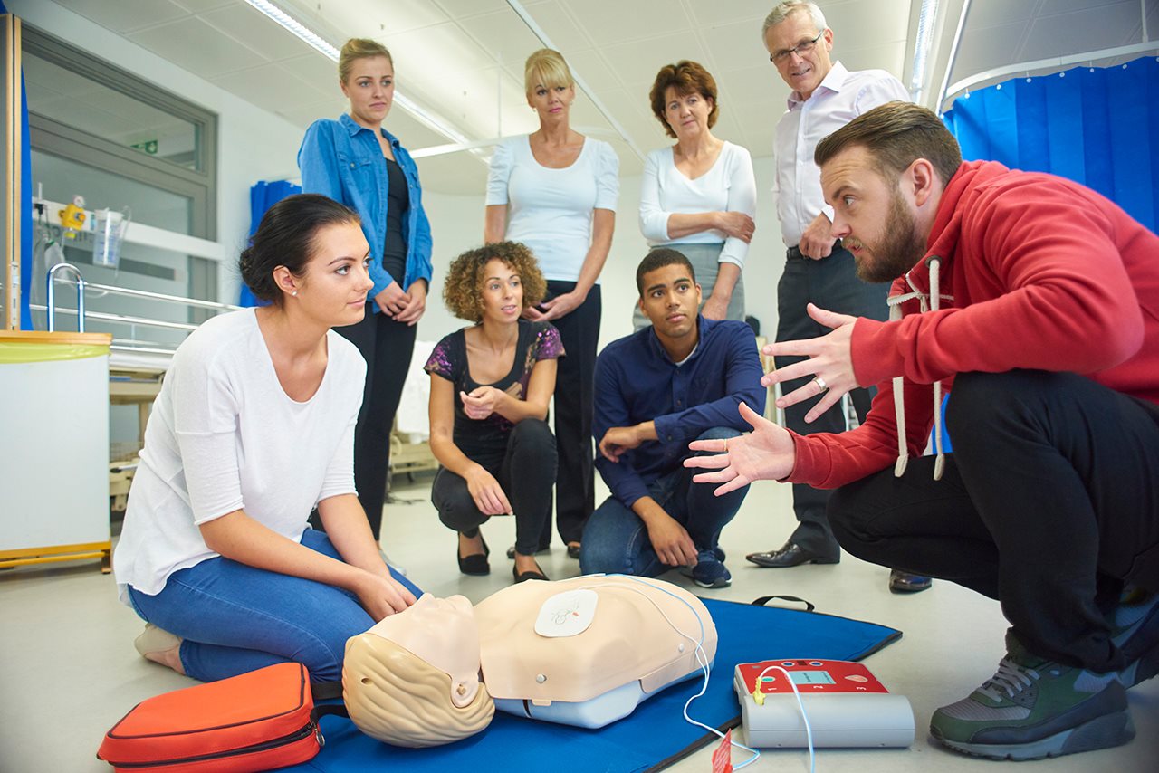 A group of parents learning CPR